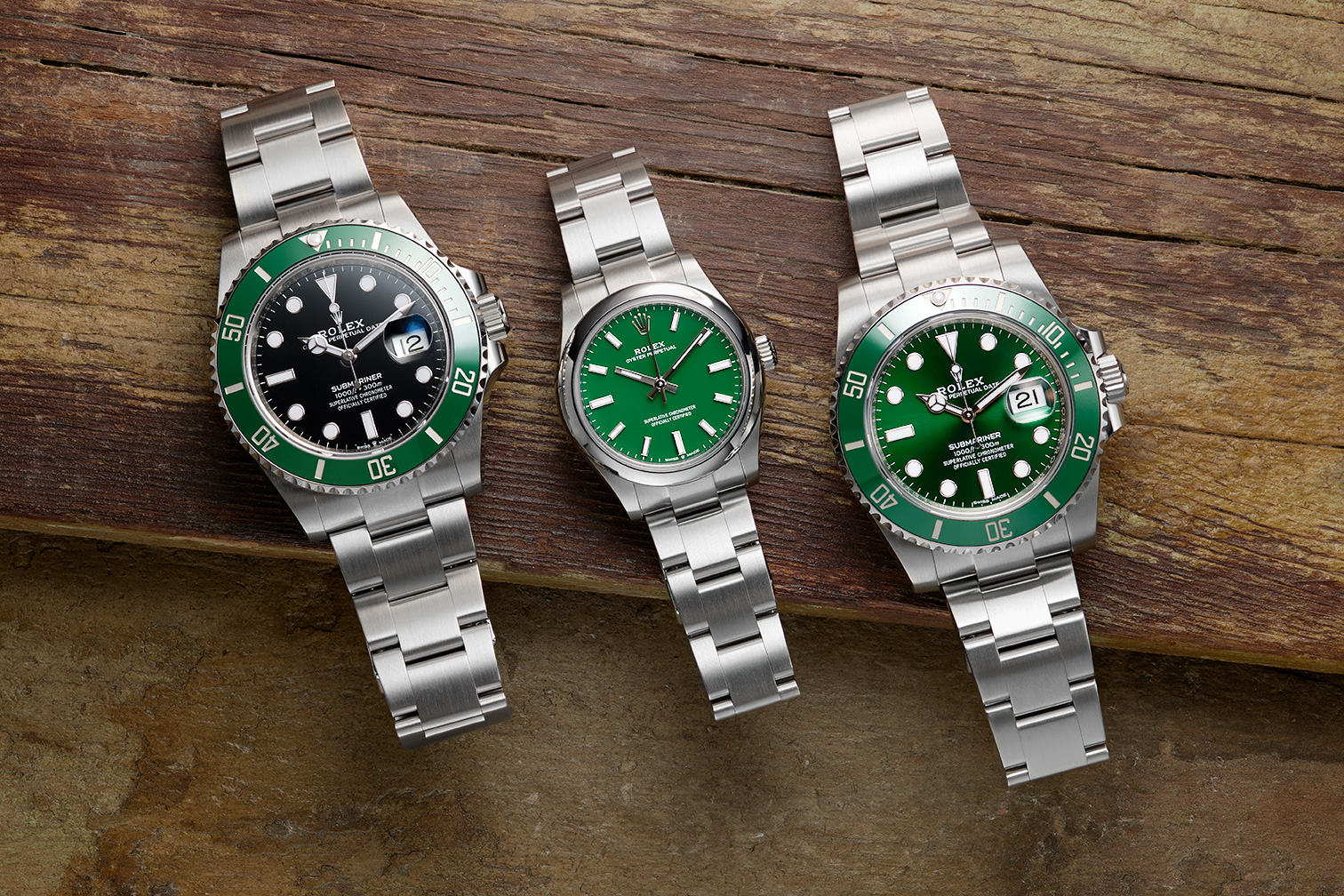 Rolex Kermit, Rolex 124300 Oyster Perpetual Green Dial, and Rolex Hulk all on a rustic wooden flank for the Watch Standard social media.