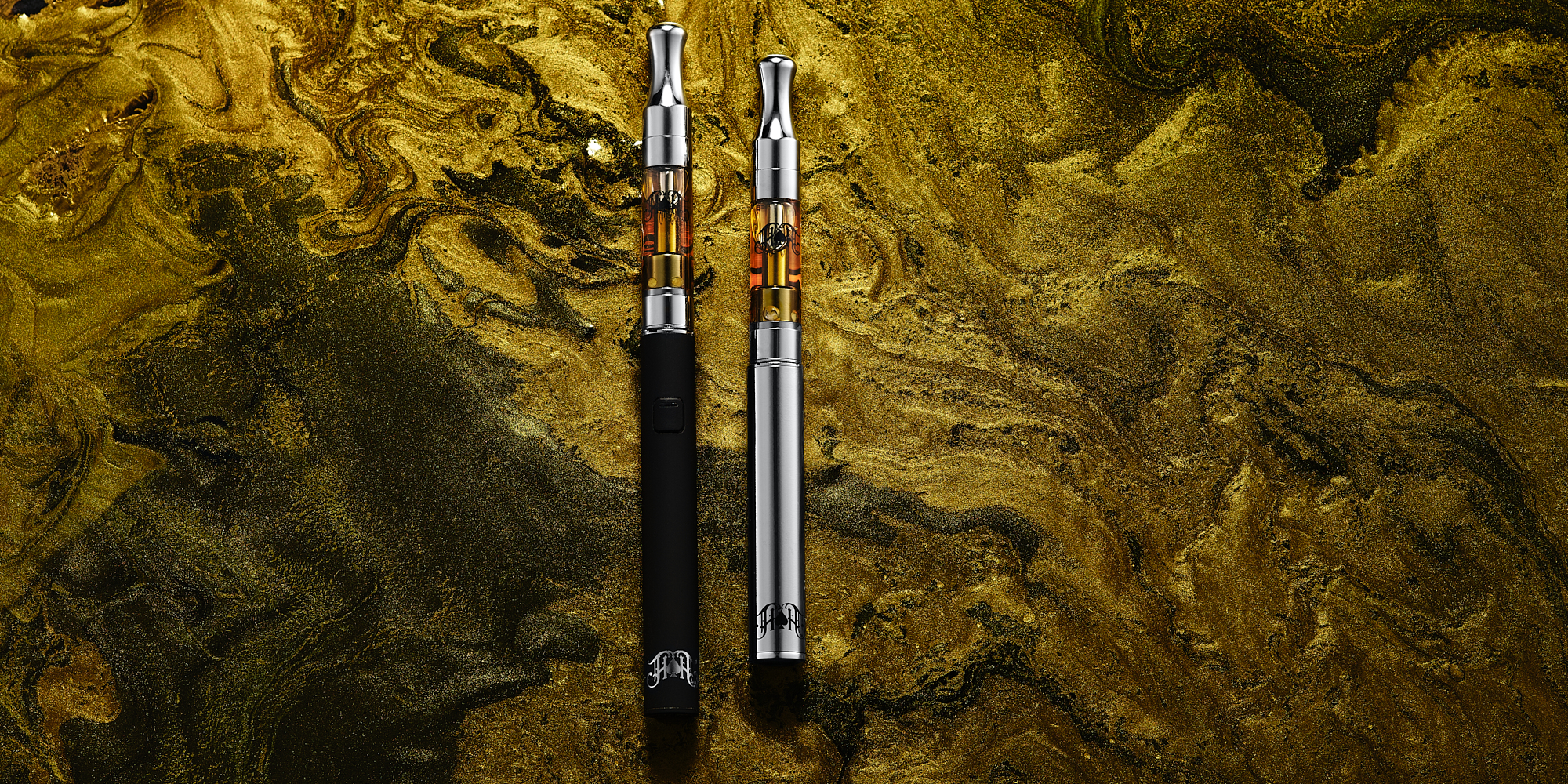 Heavy Hitters Vape Pen on a Acapulco gold ink background