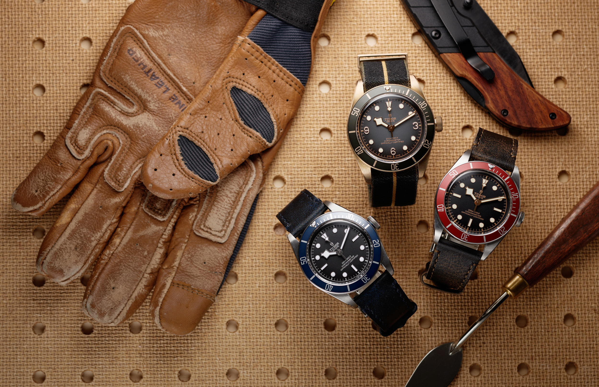 Father's Day Watch Gifts for working father. Tudor Watches surrounded by a working glove, pocket knife, and a putty knife for the Watch Standard. 